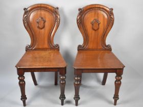 A Pair of Victorian Mahogany Hall Chairs with Shield Moulded Backs