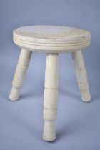 A Cream Painted Circular Topped Three Legged Milking Stool, 19cm Diameter and 23.5cm high