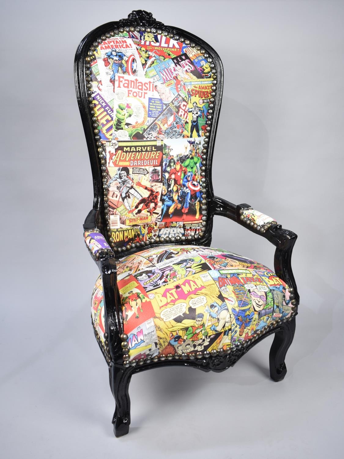 A Victorian Style Chair Upholstered in Comic Book Fabric