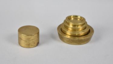 A Graduated Set of Four Brass Bank Sovereign Coin Weights and a Circular Weight for £5 Silver