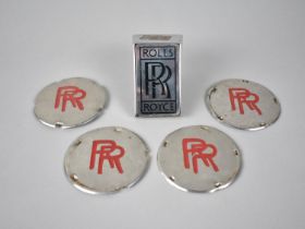 A Collection of Various Rolls Royce Hubcaps and Bonnet Badge