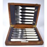 An Edwardian Cased Set of Six Fish Knives and Forks with Bakelite Handles