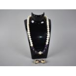 An Equilibrium Genuine Freshwater Pearl, Purple and Jewelled Bead Necklace Together with a Pair of