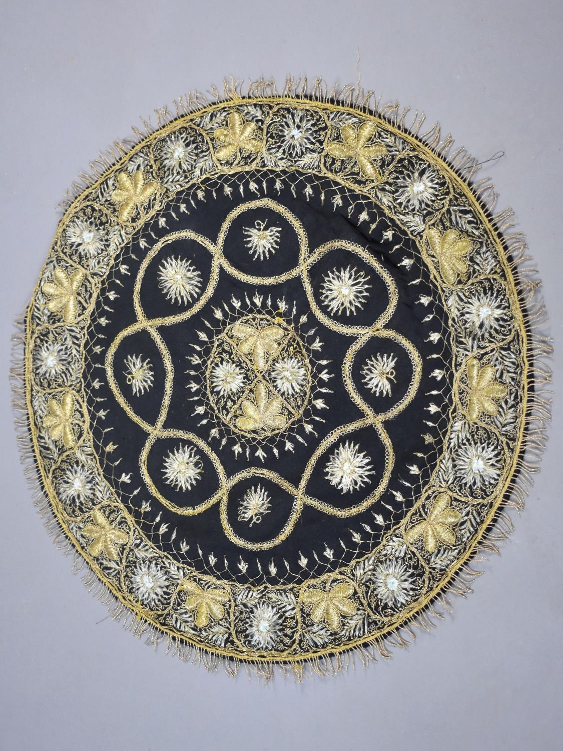 An Indian Gilt Wire Embroidered Centre Table Cloth, 56cms Diameter