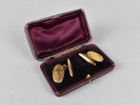 A Pair of Gold Coloured Metal Cufflinks, Oval Plaque with Engraved Decoration, 4.1gms, in Fitted