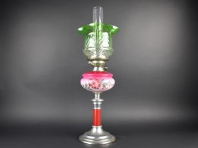 A Late Victorian/Edwardian Oil Lamp with Metal Base, Opaque Pink Glass Reservoir, Green Shade and