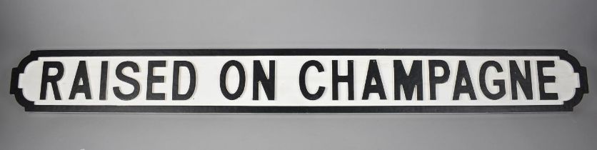 A Modern Wooden Wall Sign in the Manner of a Victorian Street Sign, 'Raised on Champagne', 124cms