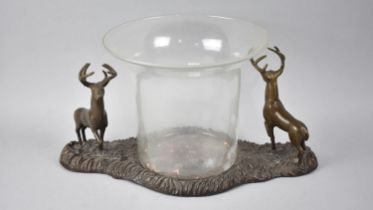 A Large Bronze and Glass Planter with Stag Mounts Either Side Flared Cylindrical Glass Container,