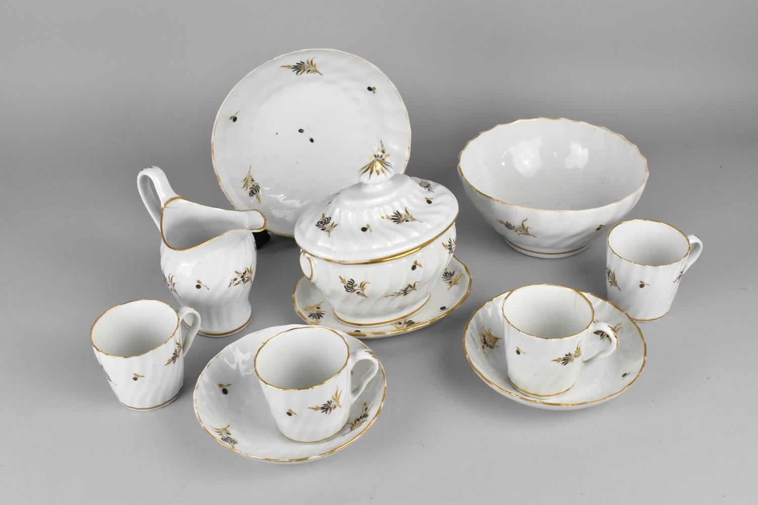 A Late 18th/Early 19th Century Porcelain Service of Wrythen Form Decorated with Gilt Detailing