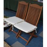 A Pair of Modern Folding Teak Garden Chairs