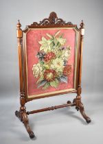 A Mid/Late 19th Century Mahogany Framed Stumpwork Screen with Heraldic Lion Rampant Shield Finial,