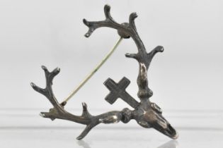 A Silver Brooch Modelled as a Stag's Head Hunting Trophy Surmounted by Cross, Replacement Pin