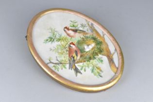 A Late 19th/Early 20th Century Painted Oval Porcelain Panel Depicting Goldfinches with Eggs in Nest,