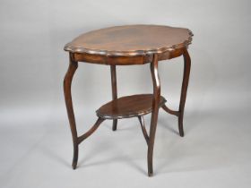 An Edwardian Mahogany Oval Topped Occasional Table with Cabriole Supports and Stretcher Shelf,
