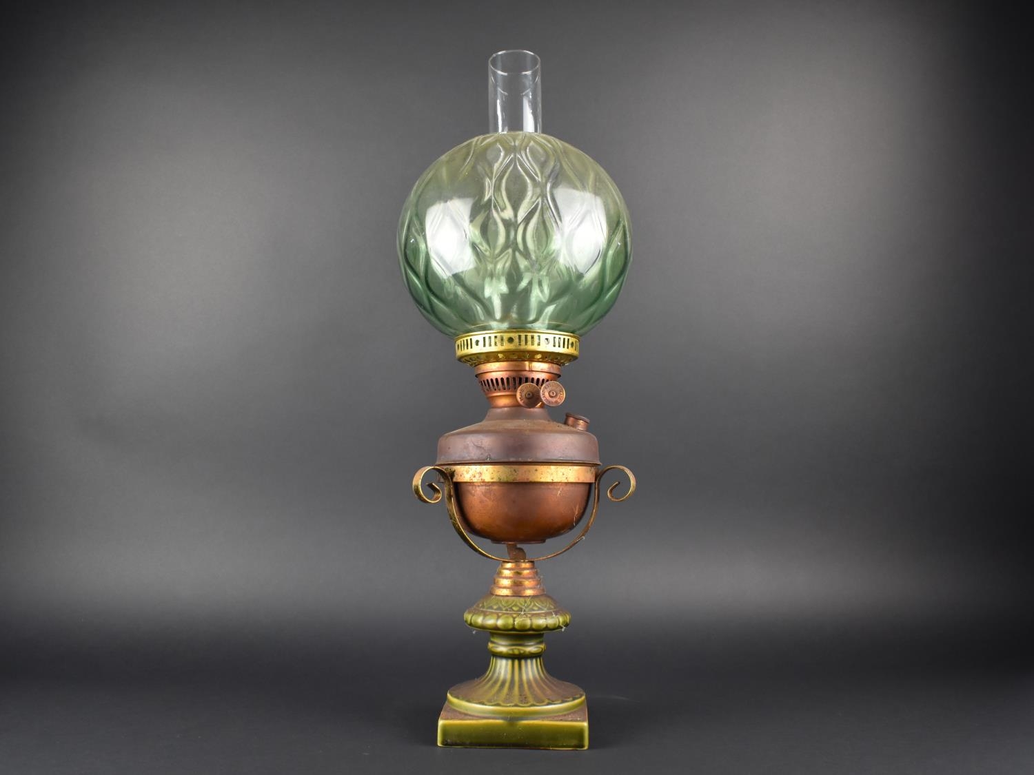 A Late Victorian/Edwardian Oil Lamp in Ceramic and Metal Holder, Green Glass Globe Shade and Plain