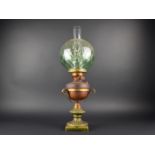 A Late Victorian/Edwardian Oil Lamp in Ceramic and Metal Holder, Green Glass Globe Shade and Plain