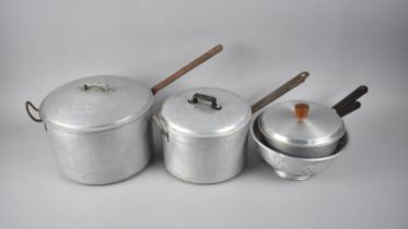 A Collection of Various Aluminium Saucepans and a Colander