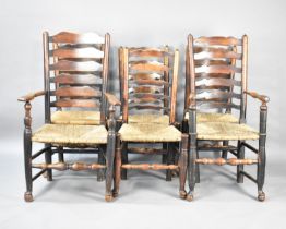 A Set of Six Harlequin Rush Seated Ladder Back Dining Chairs, Some with Condition issues and Carvers