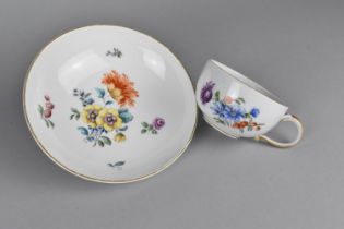 A German Porcelain Cup and Saucer Both Hand Painted with Flowers and with Gilt Trim, Blue Cross