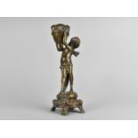 A Reproduction Bronze French Style Candlestick in the Form of a Cherub, 23cms High