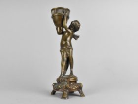 A Reproduction Bronze French Style Candlestick in the Form of a Cherub, 23cms High