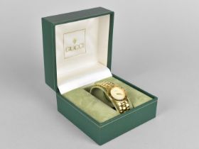 A Ladies Gucci 3300 Gold Plated Watch with Mother of Pearl Face and Having Roman Numerals to