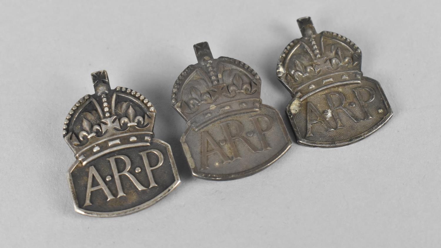 Three Silver A.R.P Badges