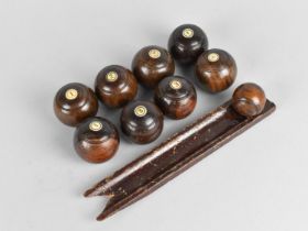 A Collection of Eight 19th Century Turned Wooden Carpet Bowls and Jack together with Launching Ramp