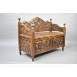 A Mid 20th Century Carved Wooden Settle with Hinged Seat, 100cs Wide