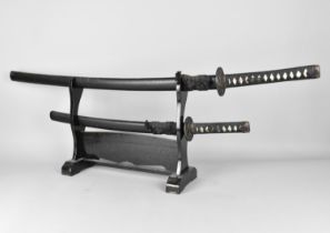 Two Reproduction Japanese Graduated Katana Swords on Display Stand, Longest 105cms Long