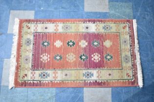 A Patterned Hearth Rug, 136x80cms