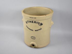 A Glazed Stoneware Etherium Drinking Water Filter with two lion Mask Carrying Handles, no Lid or