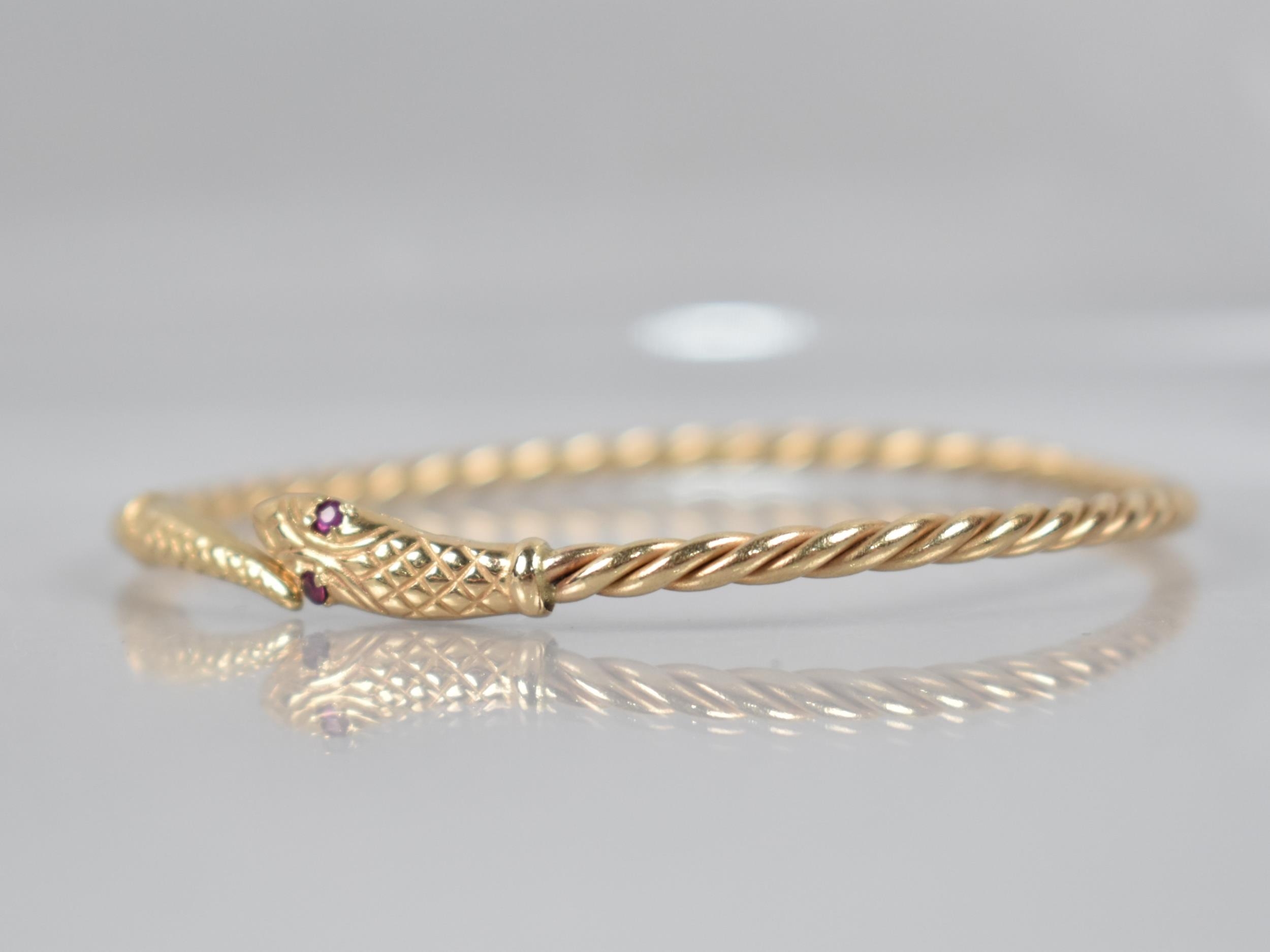 A 9ct Gold Bangle, Snake, Round Cut Ruby Eyes with Engraved Scale Decoration to Head and Tail, and - Image 3 of 5