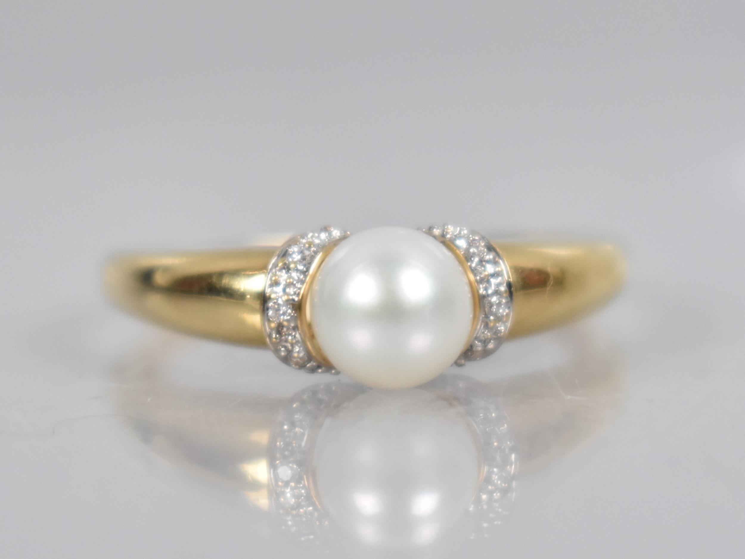 An 18ct Gold Pearl and Diamond Ring, Central Round Pearl Measuring 6.4mm Diameter, White Metal