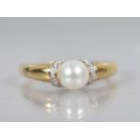 An 18ct Gold Pearl and Diamond Ring, Central Round Pearl Measuring 6.4mm Diameter, White Metal