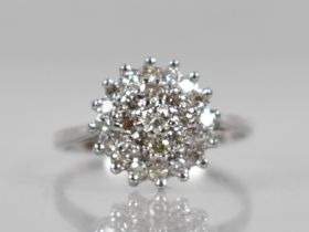 An 18ct Gold and Diamond Ring, Round Brilliant Cut Stones in Tiered Mounts, Central Stone