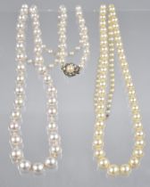 A Single Row Graduated Pearl Necklace, with Paste and White Metal Push Clasp on a White Knotted Silk