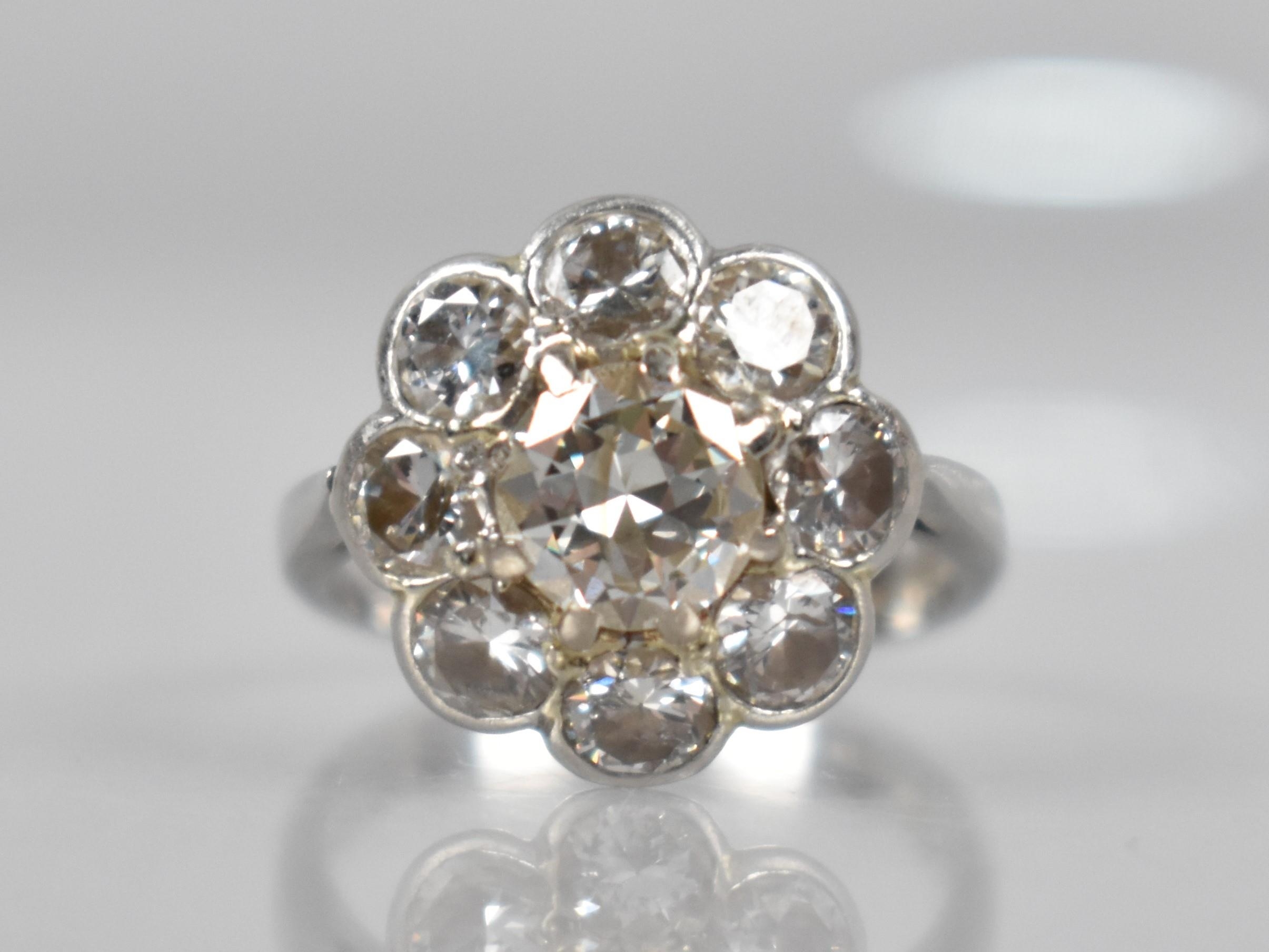 A Platinum and Diamond Daisy Cluster Ring (At Fault), Central Round Cut Diamond Measuring 6.31mm - Image 7 of 14