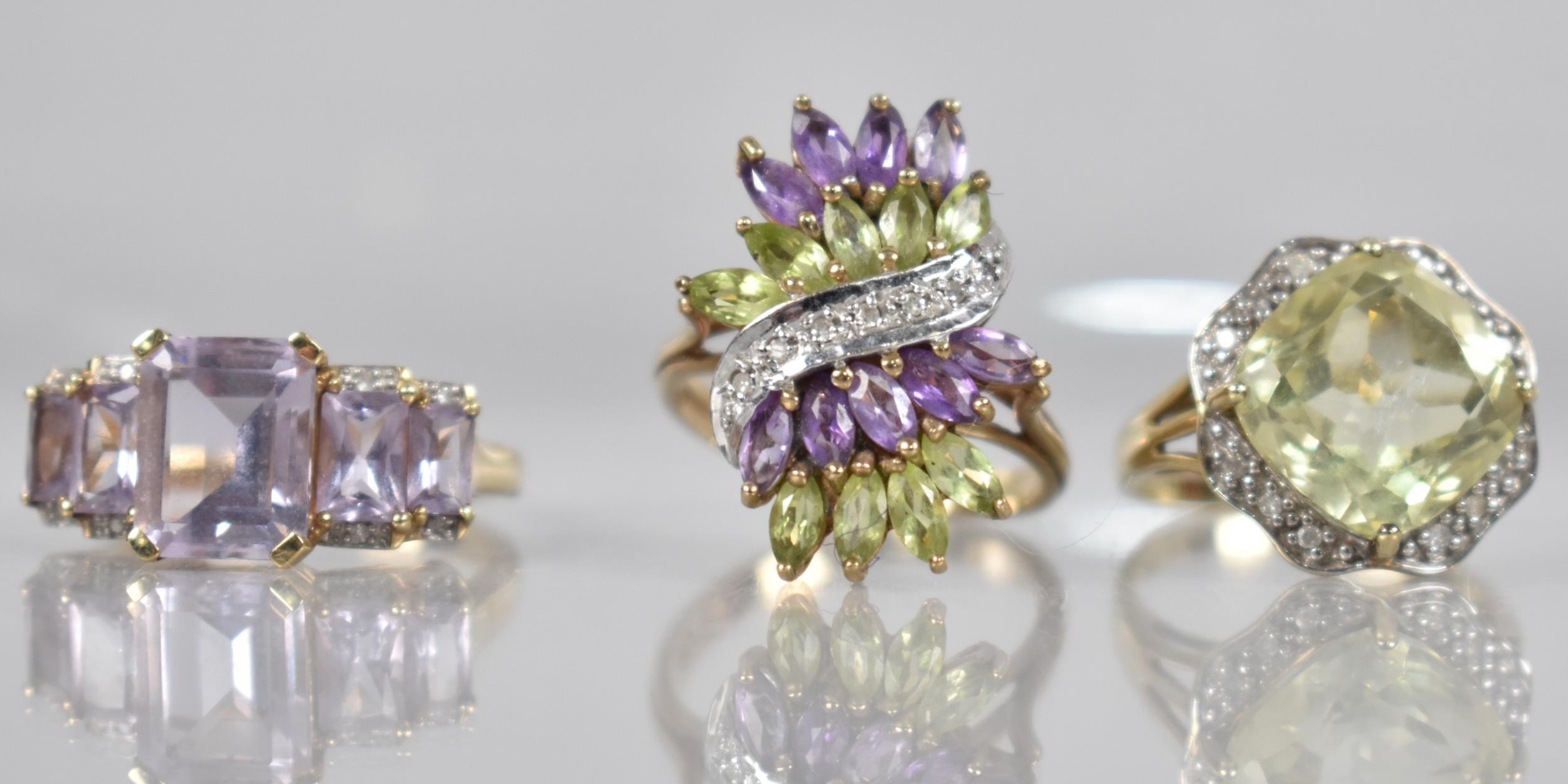 A Collection of Three Jewelled Rings, Each having Diamond Embellishments, to include Peridot,