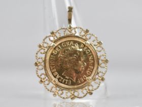 A 2004 Queen Elizabeth Half Sovereign in a 9ct Gold Mount, 5.8gms