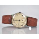 A 1930s Smiths Wrist Watch, Champagne Face with Baton Hands, Black Roman Numerals and Subsidiary