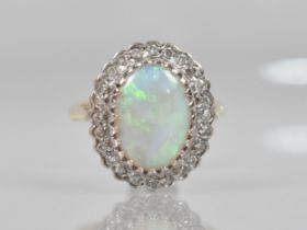 An Opal and Diamond Ladies Dress Ring in 9ct Gold, Central Oval Low Cabochon Opal Measuring 13.7mm