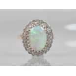 An Opal and Diamond Ladies Dress Ring in 9ct Gold, Central Oval Low Cabochon Opal Measuring 13.7mm