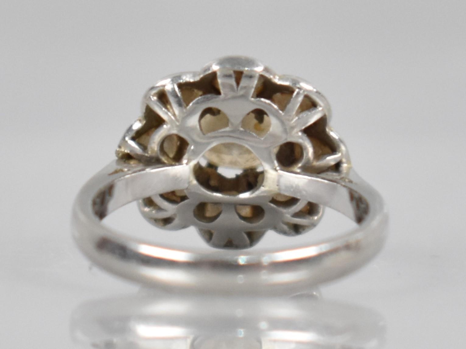 A Platinum and Diamond Daisy Cluster Ring (At Fault), Central Round Cut Diamond Measuring 6.31mm - Image 2 of 14