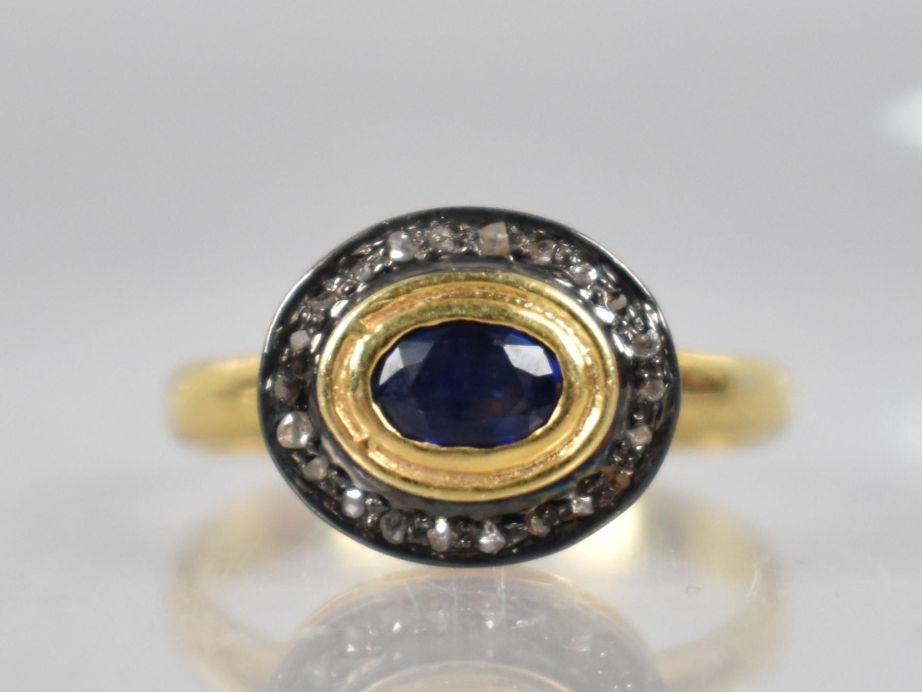 A Sapphire and Diamond Mounted Ring, Oval Cut Collet Mounted Sapphire Measuring Approx 0.30ct and