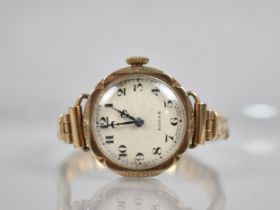 A 1930s Rolex Wristwatch, Circular Dial with Engined Turned Wavy Decoration, Black Arabic Hour