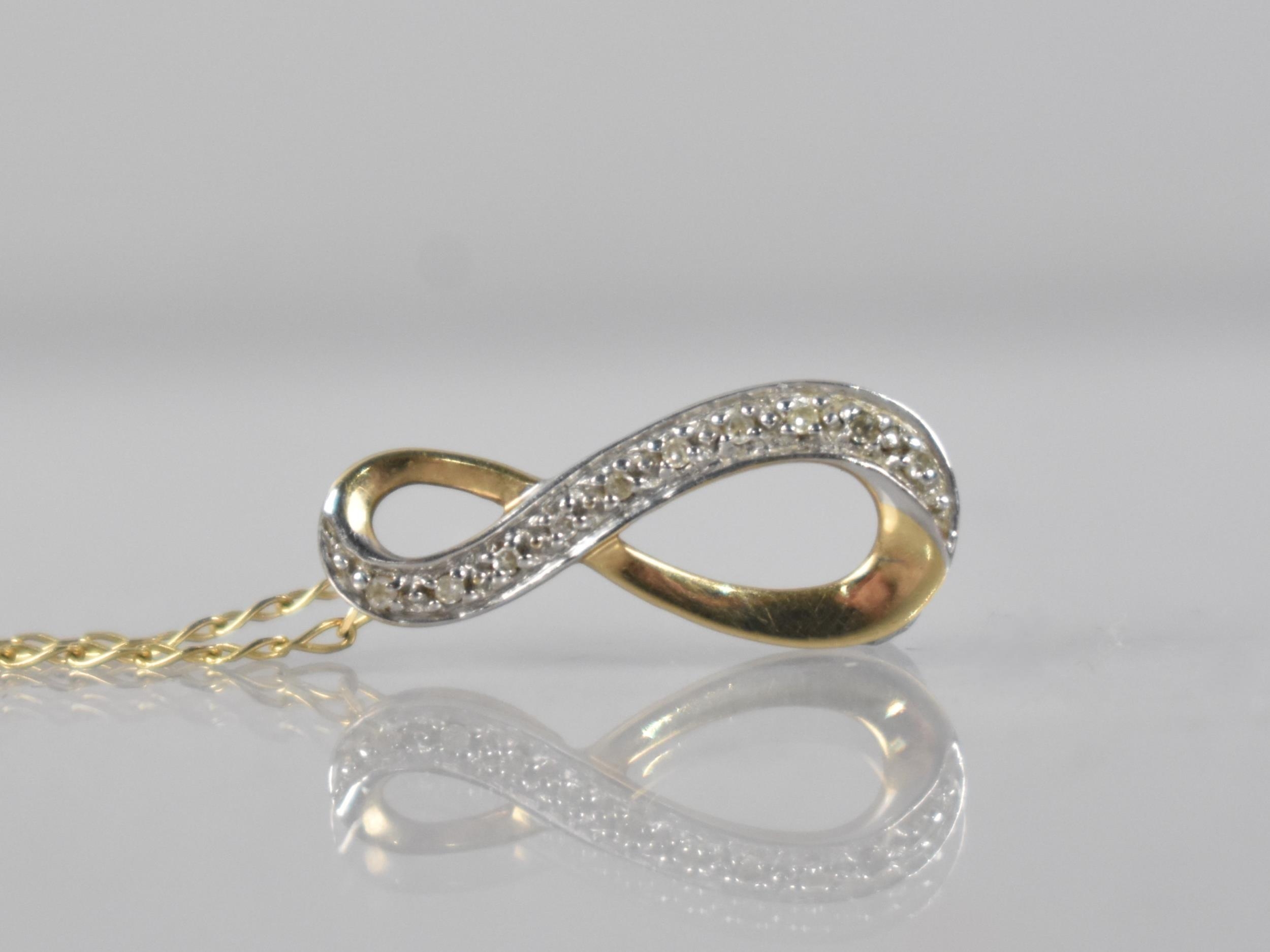 A Diamond Mounted Pendant on 9ct Gold Chain, Ten Round Cut Diamonds Milgrain Set in White Metal to