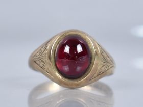 A 9ct Gold and Cabochon Garnet Signet Style Ring, Collect Set High Oval Cabochon Stone Measuring