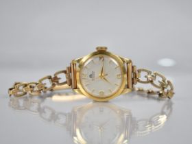 A Ladies 18ct Gold Cased Bucherer Wrist Watch, Silvered Dial with Baton and Arabic Numeral