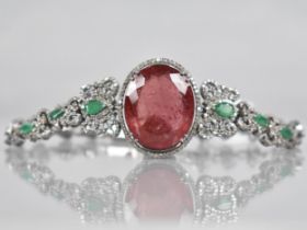 A Rubellite, Emerald and Diamond Bracelet. Large Oval Cut Rubellite Stone Measuring 26.42cts, 22.9mm